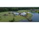 Aerial view of community amenities featuring a pool, playground, clubhouse, and lake access at 125 Beam St, Huger, SC 29450