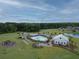 Aerial view of a neighborhood recreation area with a pool, playground, and community building at 125 Beam St, Huger, SC 29450