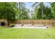 Expansive backyard featuring a lush lawn and raised garden beds, perfect for outdoor activities and gardening at 125 Beam St, Huger, SC 29450