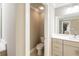 Neutral colored bathroom featuring a commode room, and a vanity with lots of storage at 125 Beam St, Huger, SC 29450