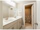 Bright bathroom featuring a double vanity, framed mirror, and natural light at 125 Beam St, Huger, SC 29450