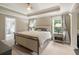 Spacious main bedroom with bedside tables, decorative lamps, and large windows for ample natural light at 125 Beam St, Huger, SC 29450