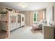 Bright bedroom featuring a playful canopy bed, cozy armchair, and serene window view at 125 Beam St, Huger, SC 29450