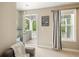 Cozy bedroom provides outdoor access and blue striped curtains at 125 Beam St, Huger, SC 29450