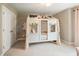 Charming bedroom showcases a whimsical canopy bed with floral accents and soft, natural light at 125 Beam St, Huger, SC 29450