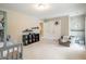 Large bedroom featuring a bunk bed, an armchair, and two door access points at 125 Beam St, Huger, SC 29450