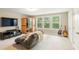 Bonus room features a television, sauna, and comfortable seating, complemented by natural light at 125 Beam St, Huger, SC 29450