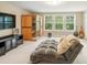 Bonus room features a sauna, comfortable seating, and natural light from the window at 125 Beam St, Huger, SC 29450