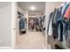 Walk-in closet with shelving and hanging space for organizing clothes and accessories at 125 Beam St, Huger, SC 29450