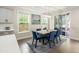 Bright dining room with a modern light fixture and access to an outdoor patio at 125 Beam St, Huger, SC 29450
