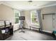 Well-lit home gym featuring a stationary bike and a bench with storage at 125 Beam St, Huger, SC 29450