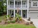 A cozy front porch with decorative plants, charming columns, and clear house number at 125 Beam St, Huger, SC 29450