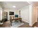 Bright home office with wooden desk, shelving unit, and space for an aquarium at 125 Beam St, Huger, SC 29450