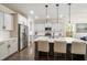 Spacious kitchen with modern appliances, stylish island, and seating for three at 125 Beam St, Huger, SC 29450