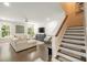 Comfortable living room with stylish staircase and bright windows at 125 Beam St, Huger, SC 29450