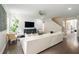 Bright living room with modern shiplap accent wall and hardwood floors at 125 Beam St, Huger, SC 29450