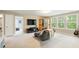 Comfortable living room with large windows, a comfy chair, and an entertainment center at 125 Beam St, Huger, SC 29450
