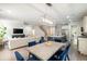 Open concept living area featuring a dining table, kitchen island, and comfortable seating at 125 Beam St, Huger, SC 29450