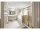 Bright and open main bathroom featuring a soaking tub and glass-enclosed shower at 125 Beam St, Huger, SC 29450