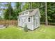 Charming outbuilding in a serene backyard setting, offering potential for storage or a hobby space at 125 Beam St, Huger, SC 29450