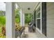 A relaxing porch with comfortable seating, beautiful planters, and a serene outdoor view at 125 Beam St, Huger, SC 29450
