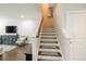 Bright staircase with hardwood treads and white risers, leading to the upper level of the home at 125 Beam St, Huger, SC 29450