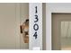 Close-up of the home's address numbers on a white post at 1304 Lieben Rd, Mount Pleasant, SC 29466