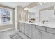 Bright bathroom with double vanity, large mirror, and a window for natural light at 1304 Lieben Rd, Mount Pleasant, SC 29466
