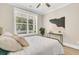 Bright bedroom with a comfortable bed and a large window showcasing outdoor views at 1304 Lieben Rd, Mount Pleasant, SC 29466