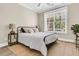 Cozy bedroom featuring a metal frame bed, neutral decor, and natural light at 1304 Lieben Rd, Mount Pleasant, SC 29466