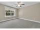 Neutral bedroom with cozy carpet, bright window, ceiling fan, and light walls for comfortable living at 1304 Lieben Rd, Mount Pleasant, SC 29466