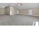 Large bonus room with cozy carpet, bright window, ceiling fan, and light walls for comfortable living at 1304 Lieben Rd, Mount Pleasant, SC 29466