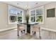Bright dining area boasts a modern light fixture and lots of natural light at 1304 Lieben Rd, Mount Pleasant, SC 29466