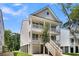Exterior view of a two-story home featuring a staircase and a balcony at 1304 Lieben Rd, Mount Pleasant, SC 29466