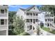 Charming two-story home with double balconies and well-manicured lawn at 1304 Lieben Rd, Mount Pleasant, SC 29466