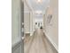 Inviting hallway with hardwood floors and neutral wall colors at 1304 Lieben Rd, Mount Pleasant, SC 29466