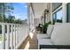 Comfortable seating on a porch with views of the street at 1304 Lieben Rd, Mount Pleasant, SC 29466