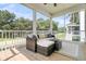 Relaxing screened-in porch featuring wicker furniture and outdoor views at 1304 Lieben Rd, Mount Pleasant, SC 29466