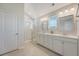 Bright bathroom featuring double vanity, mirrors, and glass door shower at 143 Airy Dr, Summerville, SC 29486