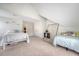 Bright bedroom featuring two beds, sloped ceilings, and fresh decor, perfect for children or guests at 143 Airy Dr, Summerville, SC 29486