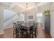 Elegant dining room featuring coffered ceilings, hardwood floors, and a stylish chandelier at 143 Airy Dr, Summerville, SC 29486