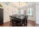 Spacious dining area with a large table, chandelier, and natural light, perfect for Gathering meals at 143 Airy Dr, Summerville, SC 29486