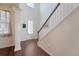 Bright foyer with hardwood flooring, a staircase, and a welcoming entrance, providing an open feel at 143 Airy Dr, Summerville, SC 29486