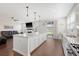 Open concept kitchen with stainless steel appliances, island, and view into the living room at 143 Airy Dr, Summerville, SC 29486