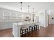 Spacious kitchen island with marble countertop, pendant lighting, and seating for casual dining at 143 Airy Dr, Summerville, SC 29486