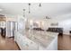 Spacious kitchen with large island, stainless steel refrigerator, and seamless flow into living spaces at 143 Airy Dr, Summerville, SC 29486