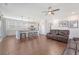 Open-concept kitchen with stainless steel appliances, a large island, white cabinetry, and hardwood floors at 143 Airy Dr, Summerville, SC 29486