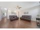 Spacious living room with hardwood floors, a ceiling fan, and ample seating, perfect for relaxing and entertaining at 143 Airy Dr, Summerville, SC 29486