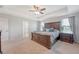Spacious primary bedroom features a ceiling fan, plush carpet, and large furniture at 143 Airy Dr, Summerville, SC 29486