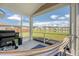 Relaxing screened porch with grill, hammock and views of the lush backyard and serene pond at 143 Airy Dr, Summerville, SC 29486